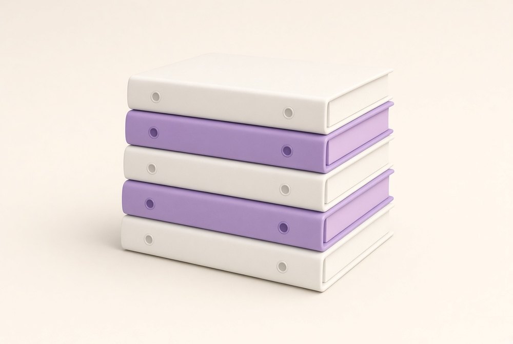 A neat stack of client document binders